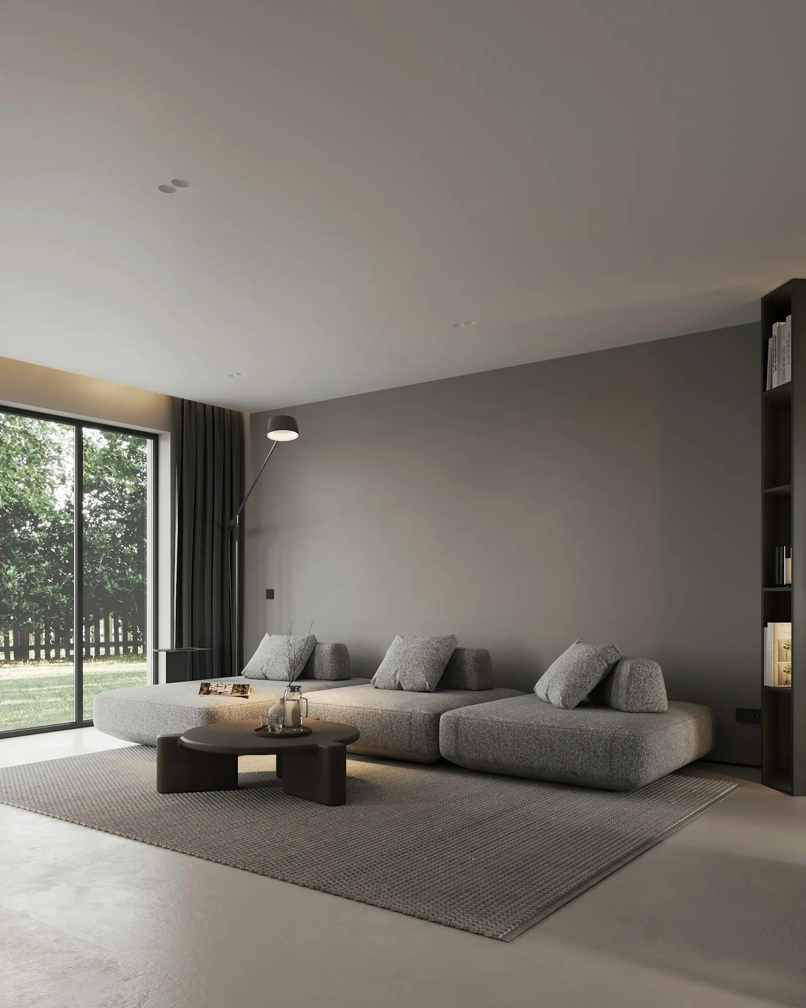 A calm grey living room with a big window onto the garden
